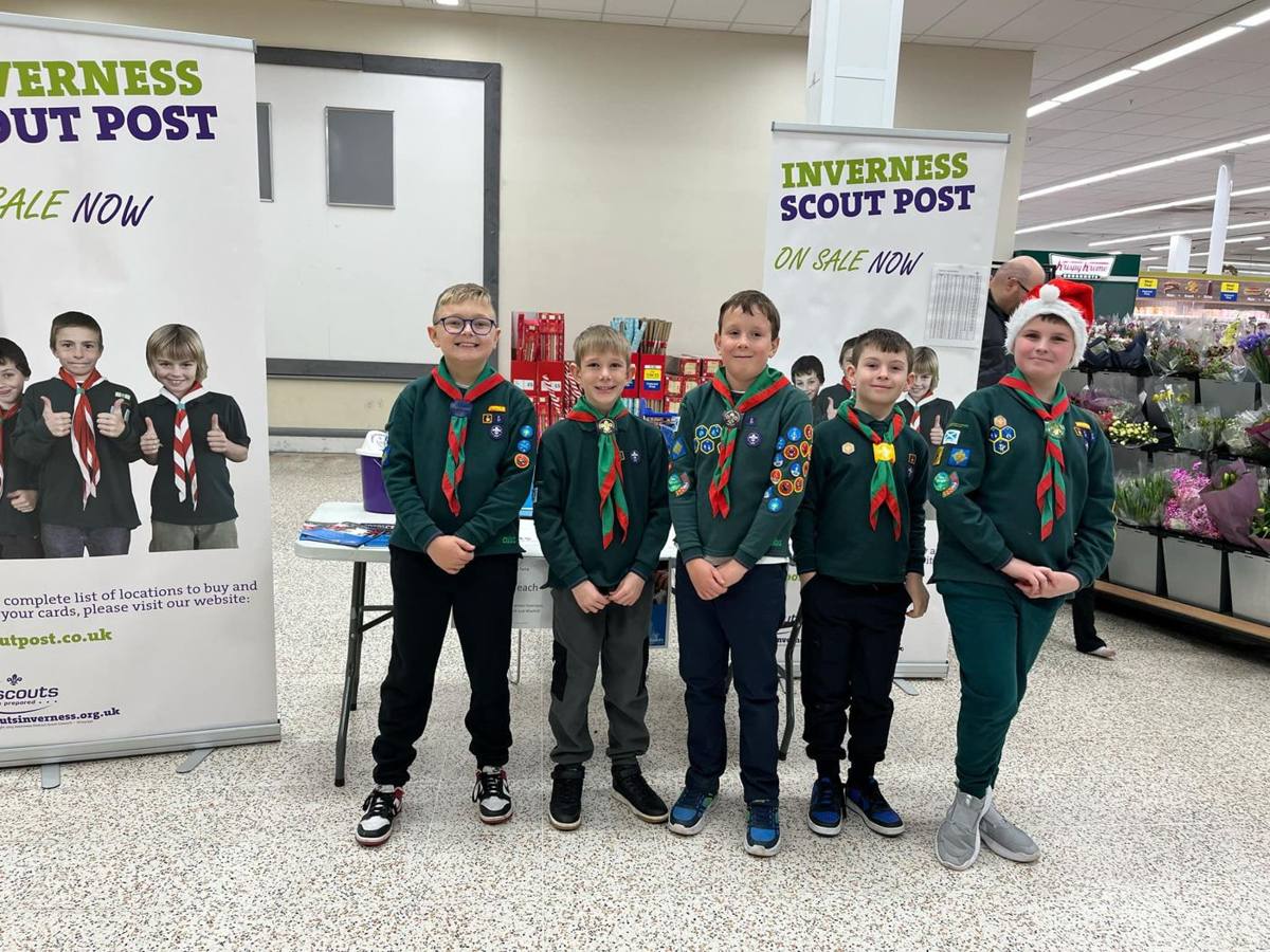 Cubs in uniform at the Scout Post stamp stall