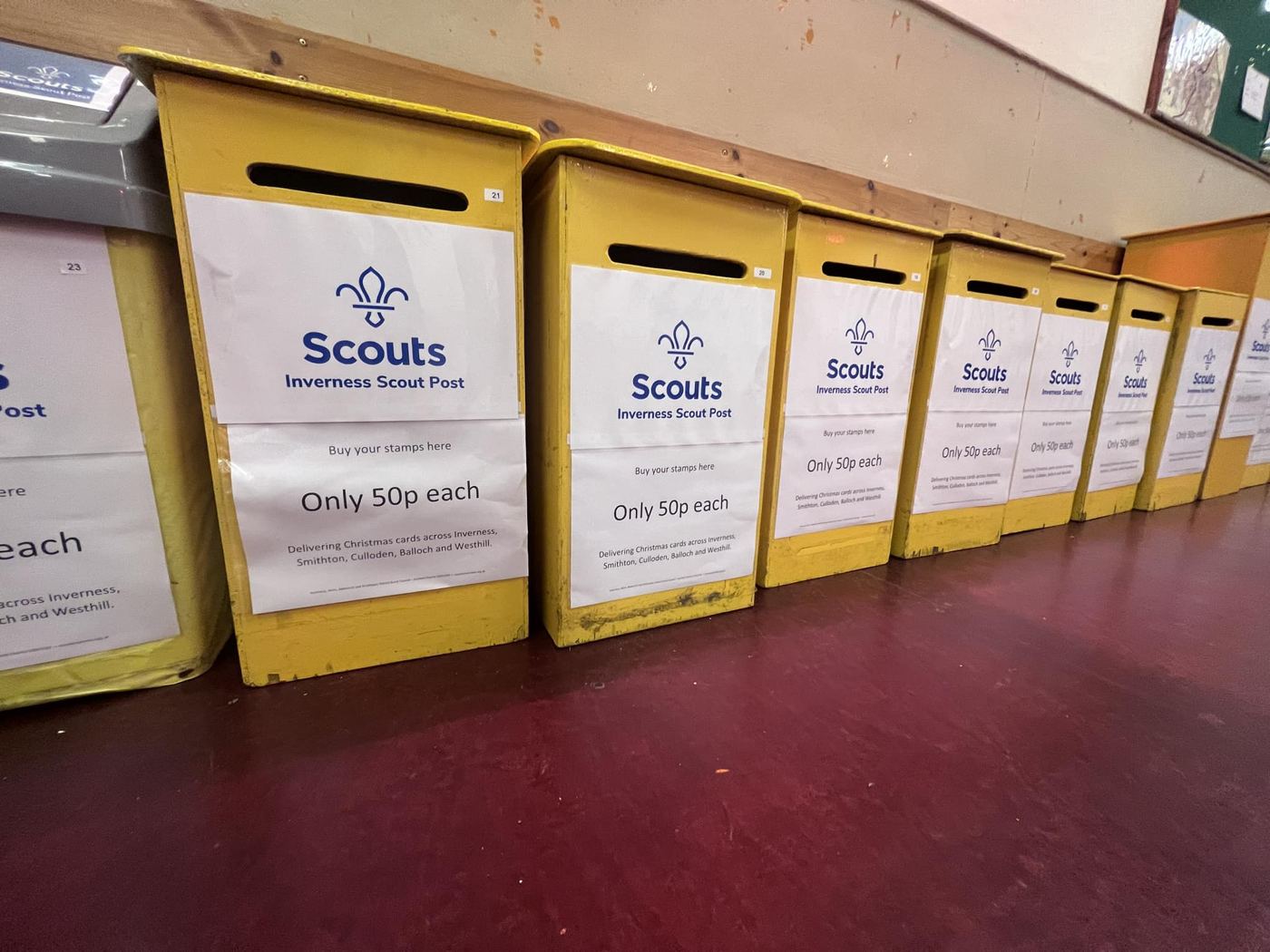 A row of yellow Scout Post boxes